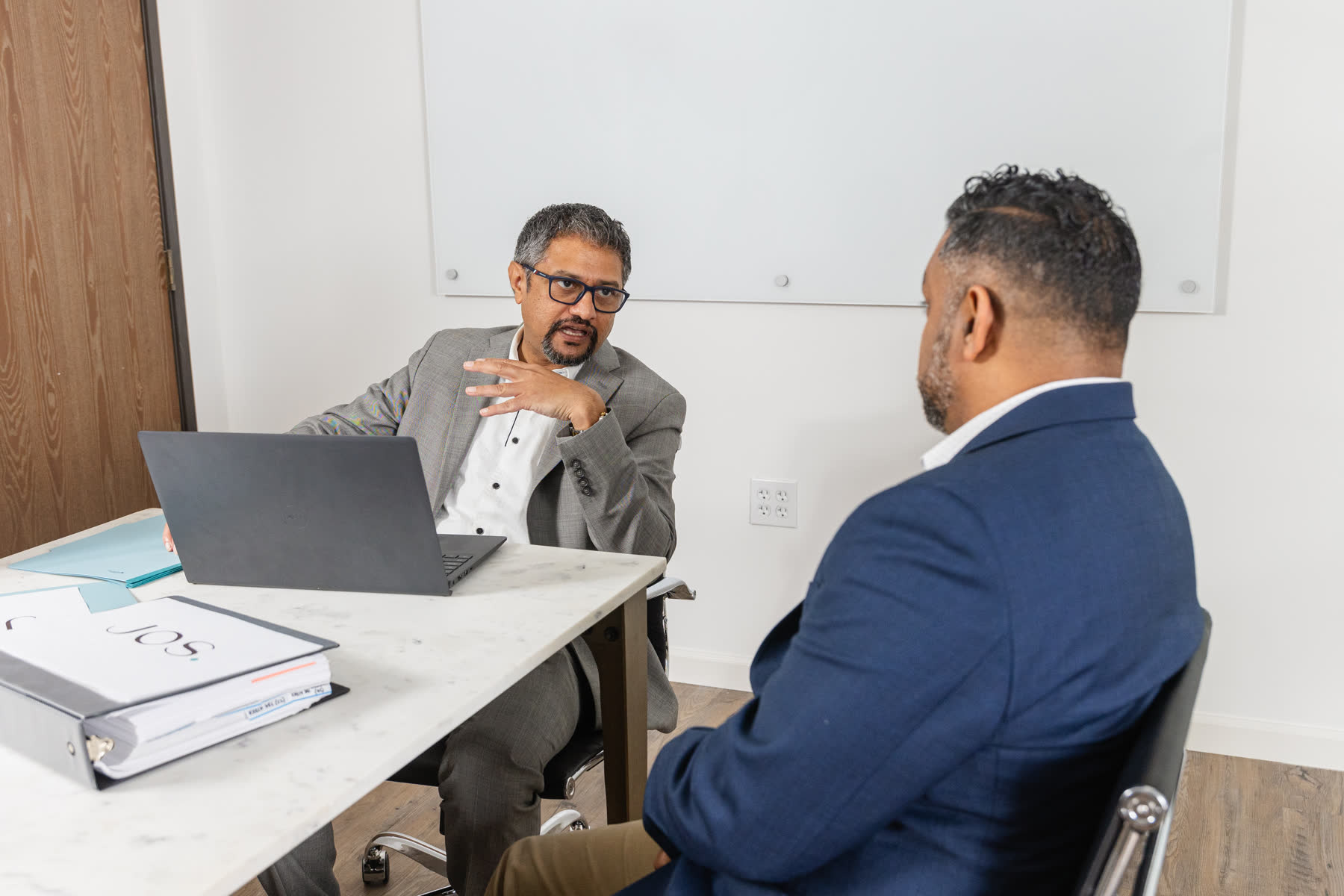 Jos Family Law attorney consulting with a client
